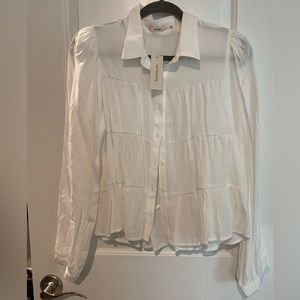 White ruffle blouse